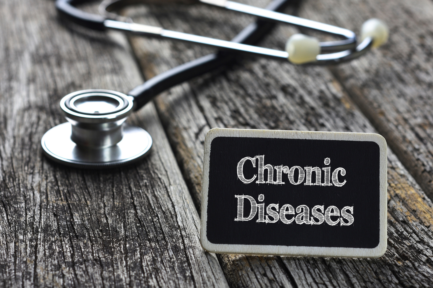 Medical Concept- Chronic Diseases word written on blackboard wit