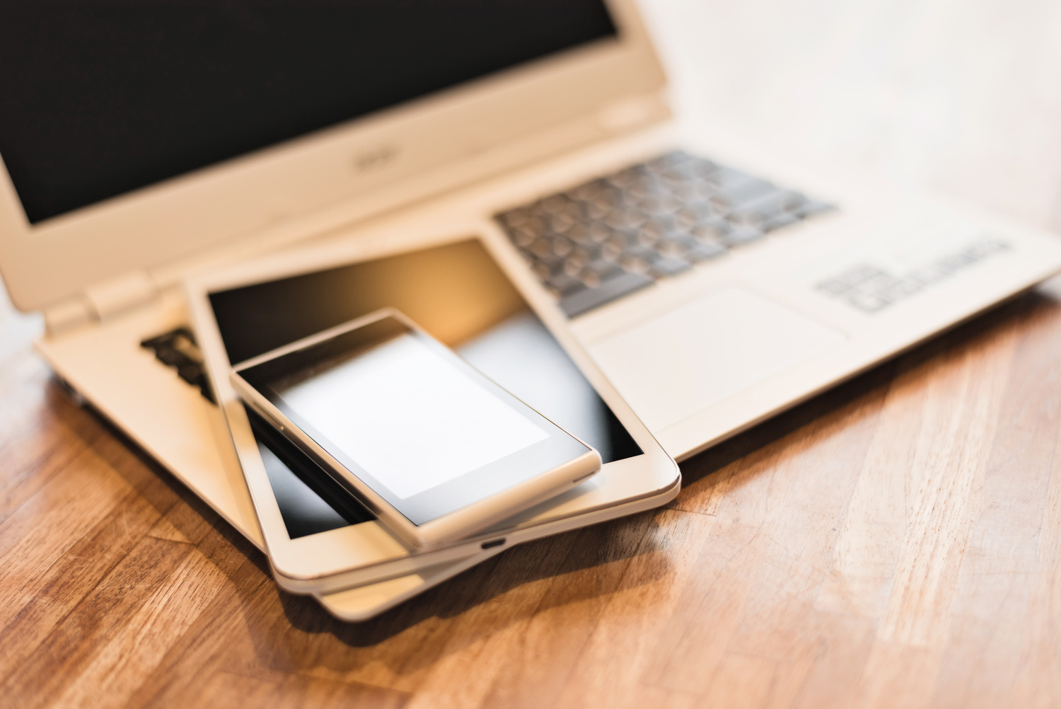 Phone and Tablet on a Laptop